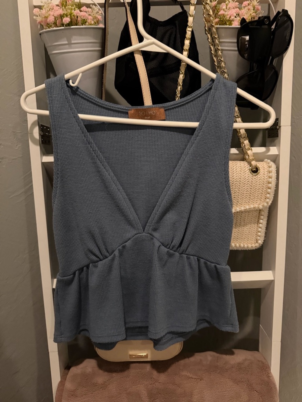 Soho Blue Peplum Sleeveless Knit Top